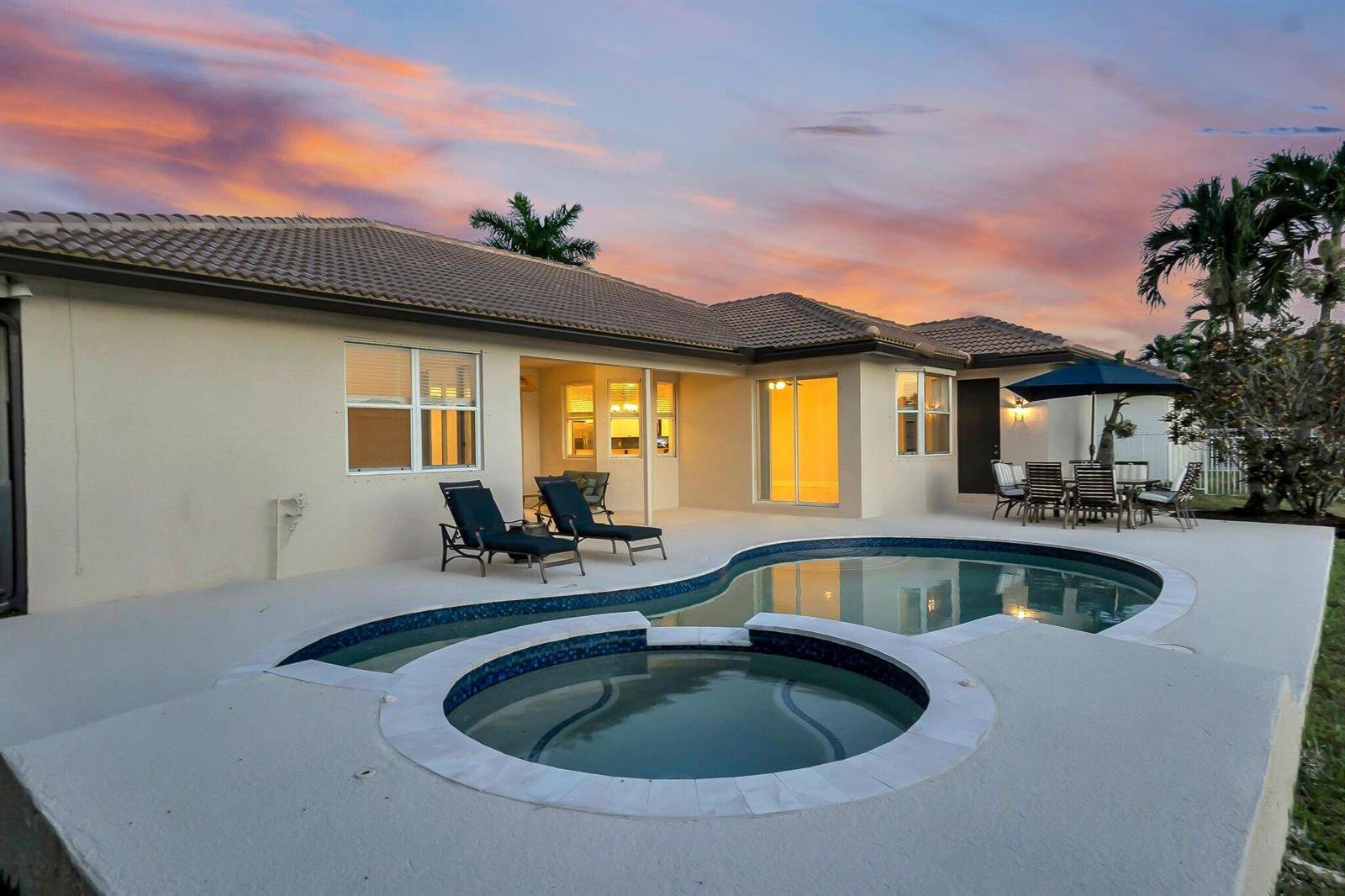 11 Stunning Lakefront Residence with Sunset Views in Cooper City
